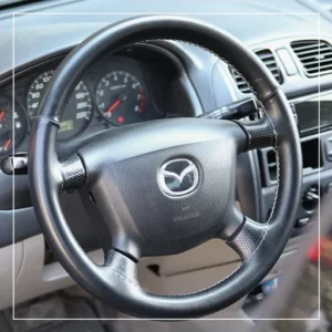 روکش فرمان دوختنی مزدا 323 Mazda برند R-507) ECCCO)
