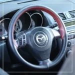 روکش فرمان دوختنی مزدا 3 Mazda برند R-506) ECCCO)